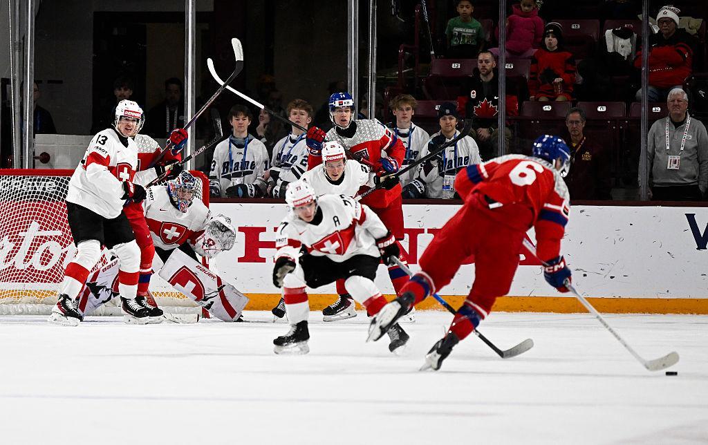 Switzerland forward attempts shot against Finland in 2026 quarter-final match