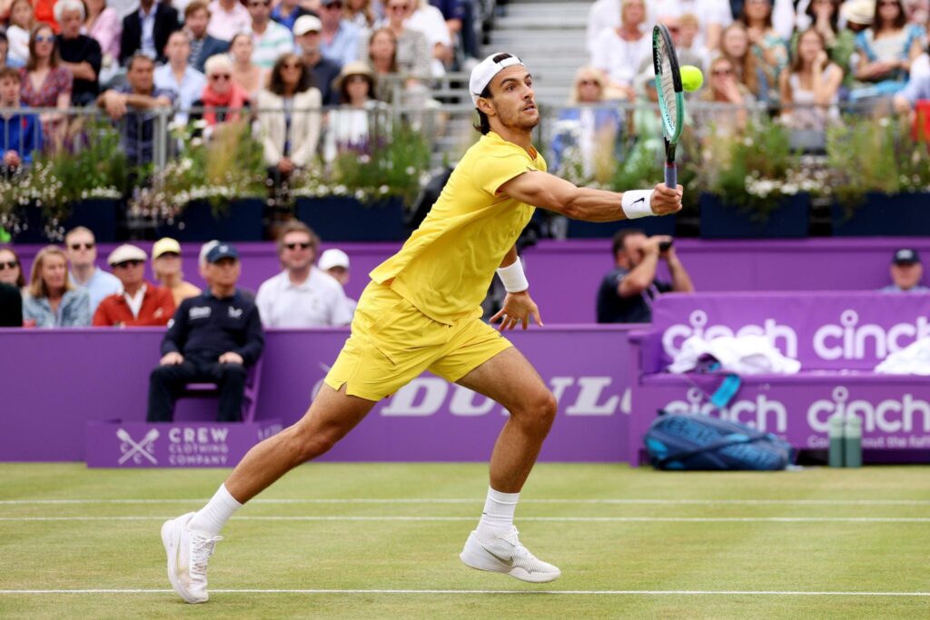 Román Burruchaga hitting a forehand during qualifiers match vs Chun-Hsin Tseng 2026 on Court 6