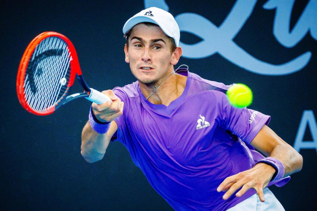 Mackenzie McDonald hitting a forehand during Round of 128 match vs Matteo Arnaldi 2026 on Court 3