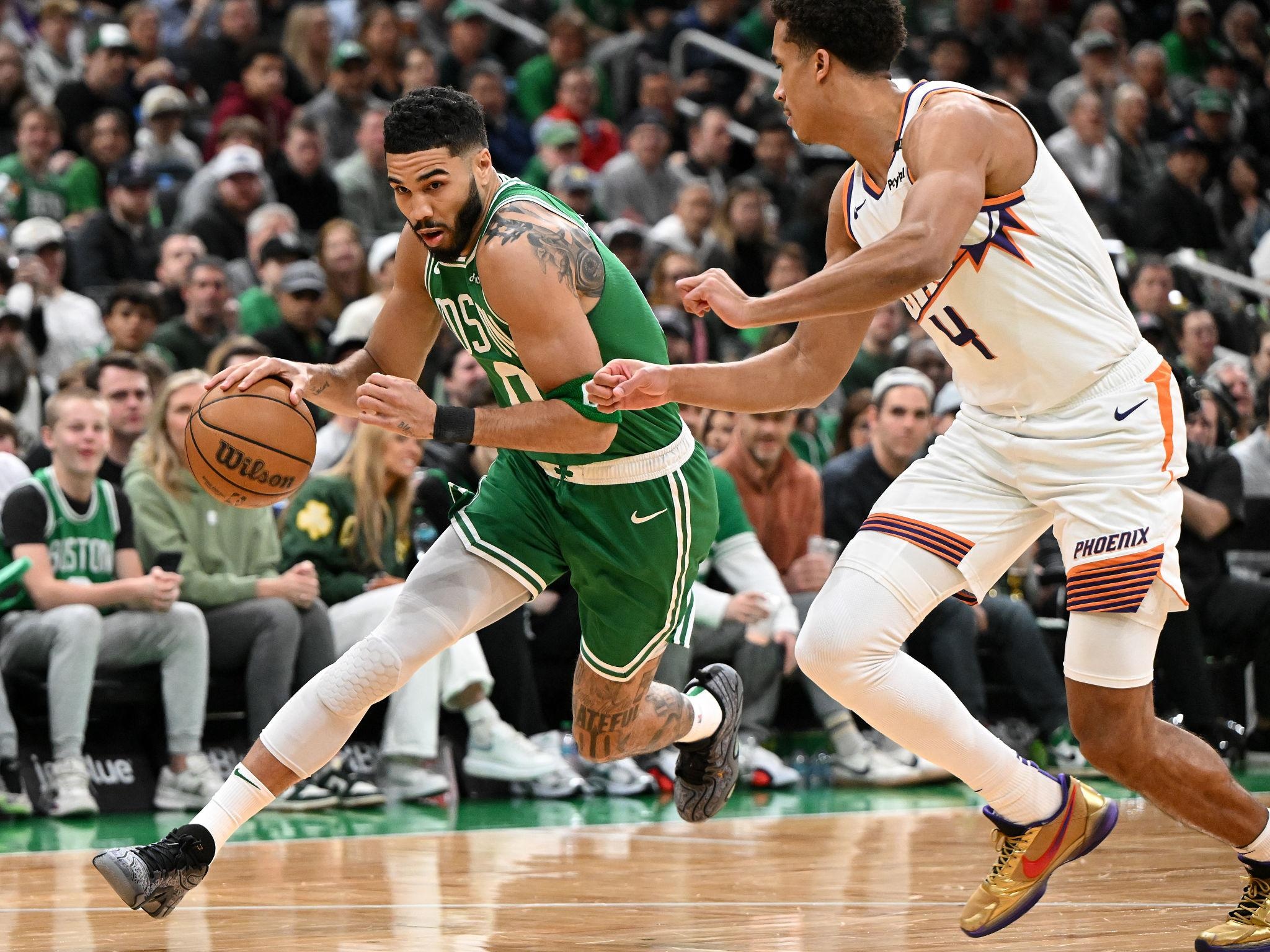 Boston Celtics player shooting during NBA match vs Phoenix Suns on March 17, 2026